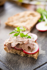 sandwich with baked meat, radish and herbs