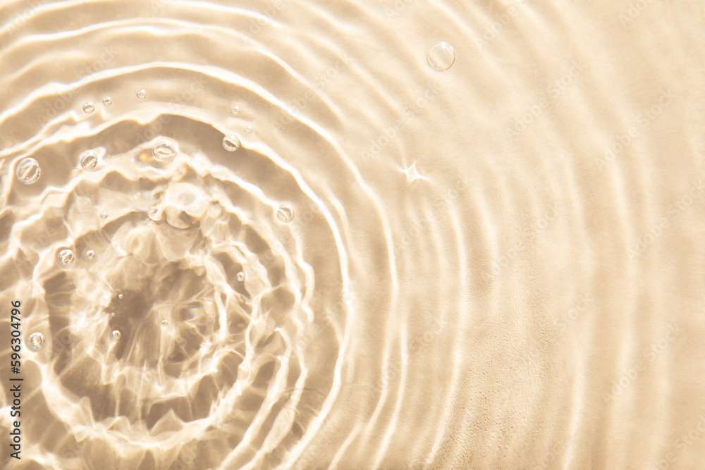 Wall mural abstract nature textured background, water waves in the pool with sun reflection, clear beige water