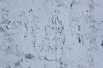 Old blue paint peeling from metal or concrete wall texture background