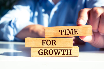 Close up on businessman holding a wooden block with a 