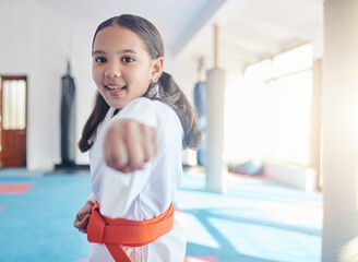 A little girl learning big lessons. Shot of a cute little girl practicing karate in a studio. © Siphosethu Fanti/peopleimages.com