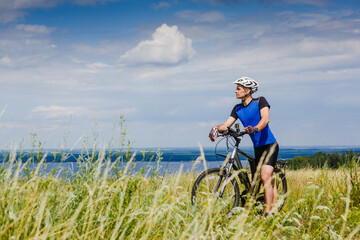 Mountain Bike cyclist on a sunny day. Healthy Lifestyle and Travel Concept