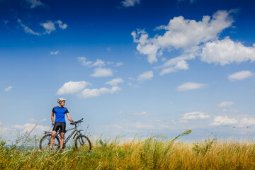 Fototapeta premium Mountain Bike cyclist on a sunny day. Healthy Lifestyle and Travel Concept