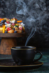front view delicious fruit cake with cup of tea dark background tea pie dough dessert sugar biscuit cake