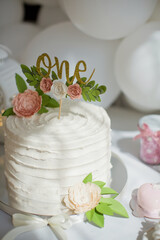 First birthday cake with white cream