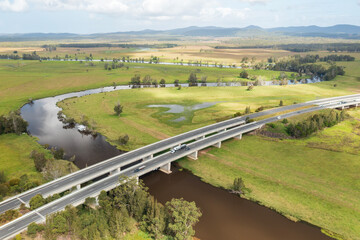 Pacific Highway crossing the meandering Myall River in farmland near Bulahdelah, NSW, Australia.