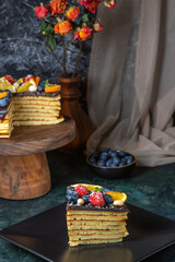 front view yummy chocolate cake with fruits on dark background dough biscuit dessert cake pie sweet tea sugar photo