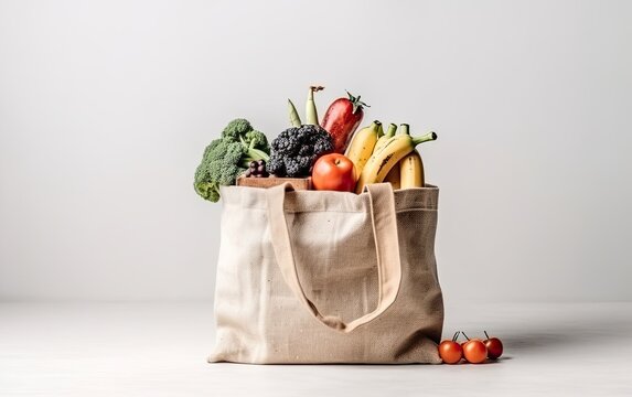 Tote bag full of vegetables and fruits on white background. Grocery with healthy food Generative AI
