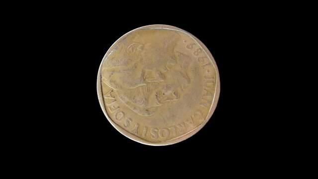 Obverse of Spain coin 500 pesetas 1989 isolated in black background. 4k video