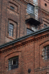Old historic abandoned red brick halls of former textile factories in Poland