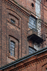 Abandoned neglected red brick buildings of the great textile industry in Lodz
