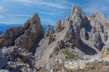 Awesome summer dolomite rocky panorama with giant pinnacles in the Latemar Massif, UNESCO world heritage site. The main pinnacle is named Torre di Pisa. Trentino-Alto Adige, Italy, Europe