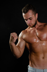 Fototapeta na wymiar Young handsome guy on a diet. A man with a beautiful athletic body.