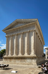 Fototapeta premium Nîmes, France - 04 19 2023: Square House. View of the monument and statue.