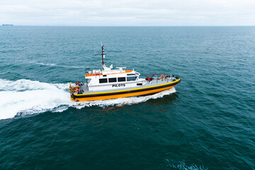 Pilot offshore ship at sea in motion.