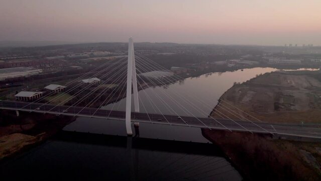 Drone tracks around Northern Spire bridge Sunderland during hazy winder dawn
