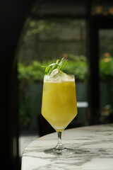 Summer cocktail glass with ice cubes