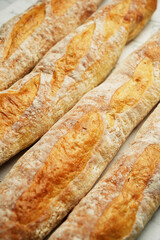Fresh baguette bread, close-up. French loaf of bread