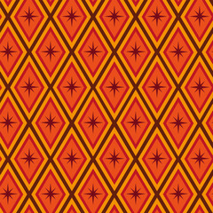 Mid century modern atomic starbursts seamless pattern  on retro diamond geometric shapes in orange, red, tangerine and brown. For backgrounds, fabric, textile , home décor and wallpaper 