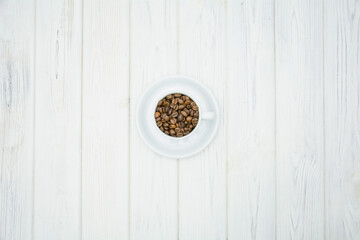 A cup of aromatic fresh natural coffee beans