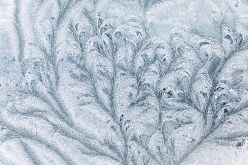 Abstract ice textures on car window in winter