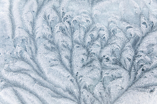 Abstract ice textures on car window in winter