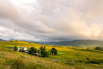 Fototapeta na wymiar Isle of Skye landscape with dramatic sky at sunset, Scotland, UK
