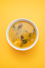 Vegetable cream soup with spinach in bowl