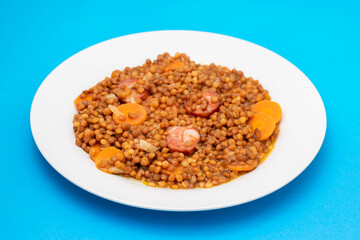 Lentils with chorizo and carrot. Typical Spanish recipe.