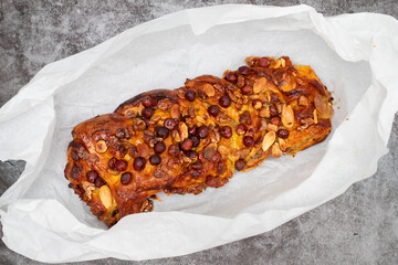 cake with dry fruits and canned sugar on paper