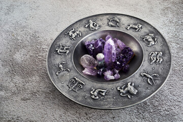 Crystals for healing, fortune telling and astrologhy circle on grey background. Esoteric and life coaching concept.