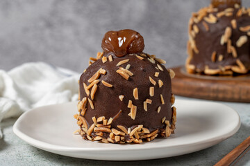 Chestnut and chocolate cake. Delicious cake with cream filling. Studio shoot. Bakery products. Close up
