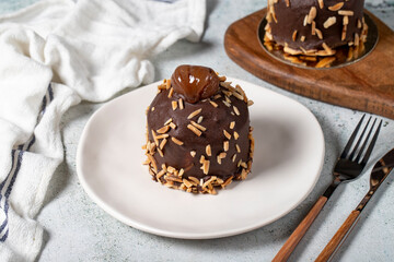 Chestnut and chocolate cake. Delicious cake with cream filling. Studio shoot. Bakery products