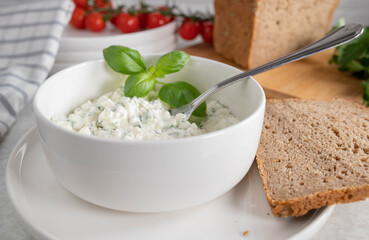 Heart healthy meal with marinated cottage cheese salad with herbs and olive oil. Served with rye bread