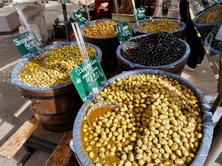 Assortment of green and black olives at local farmers market in Aix-en-Provence, Provence, France.