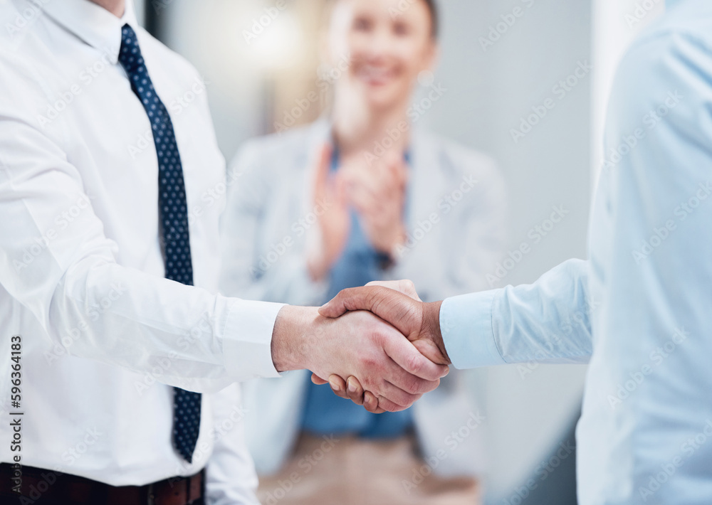 Poster the start of a great partnership. shot of two unrecognizable businesspeople shaking hands in an offi