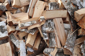 Firewood in a pile. Freshly chopped firewood