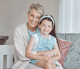 She reminds me of my youth. Shot of a mature woman bonding with her granddaughter at home.
