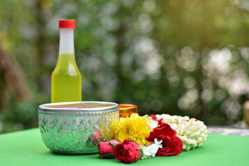 Jasmine water and rose petals in a bowl for Songkran festival in Thailand. with space for text.