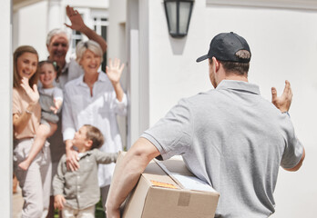 Eagerly awaiting his arrival. Cropped shot of a family waving at a male courier who is out making deliveries.