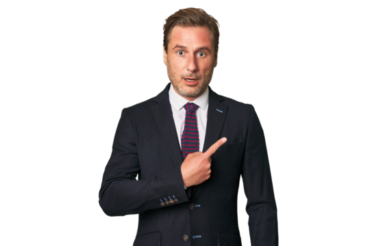 A middle-aged businessman isolated pointing to the side