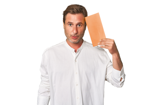 Middle-aged gentleman captivated by letter in this pensive studio portrait, exuding sincerity and depth.