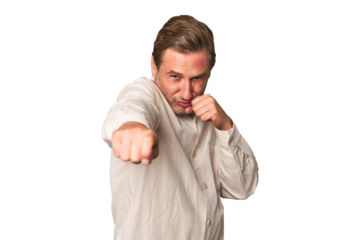 A middle-aged man isolated throwing a punch, anger, fighting due to an argument, boxing.