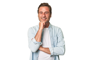 A middle-aged man isolated smiling happy and confident, touching chin with hand.