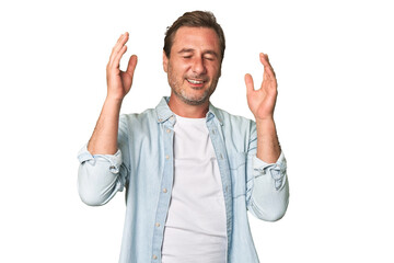 Fototapeta premium A middle-aged man isolated joyful laughing a lot. Happiness concept.