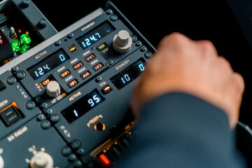 The captain presses the buttons on the control panel to start the engine of the plane flight Up close flight simulator