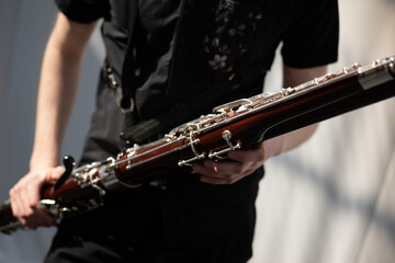 Musician playing the bassoon - obrazy, fototapety, plakaty