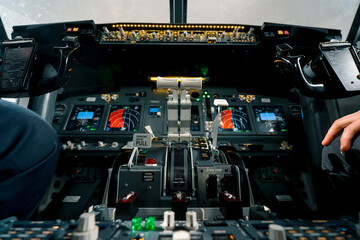 thrust lever in the cockpit of an airplane a close-up view of a flight on an aircraft simulator