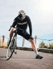 Looking for motivation. Full length shot of a handsome mature man taking a break while cycling...