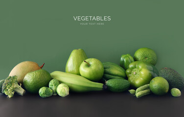 Set raw healthy food clean eating vegetables source of protein for vegetarians:green peas, avocado, broccoli, lime, green orange, pepper and green mango on green and black background.